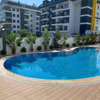 Modern 1+1 apartment in Kargicak — new residence with pool close to the sea
