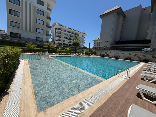1+1 Apartment in Kargicak Near the Sea — Furnished Property in a Modern Residence