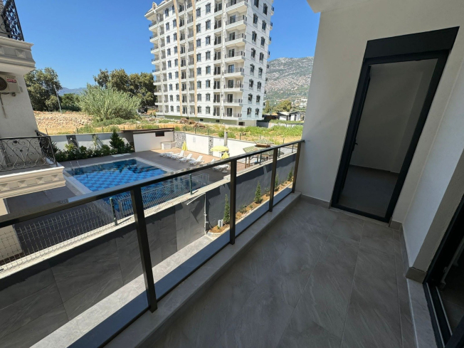1+1 Apartment in Mahmutlar — New 2026 Building, 600 m from the Sea, €63,000
