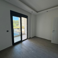1+1 Apartment in Mahmutlar — New 2026 Building, 600 m from the Sea, €63,000