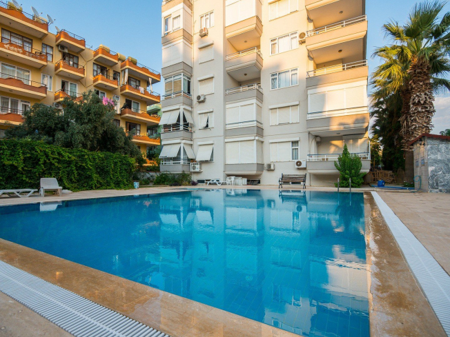 1+1 Apartment in Cleopatra, Alanya — Furnished Property with Pool, Sea View and Residence Permit Potential