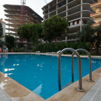 1+1 Apartment in Cleopatra, Alanya — Furnished Property with Pool, Sea View and Residence Permit Potential