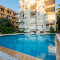 1+1 Apartment in Cleopatra, Alanya — Furnished Property with Pool, Sea View and Residence Permit Potential