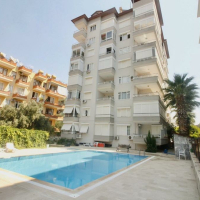 1+1 Apartment in Cleopatra, Alanya — Furnished Property with Pool, Sea View and Residence Permit Potential