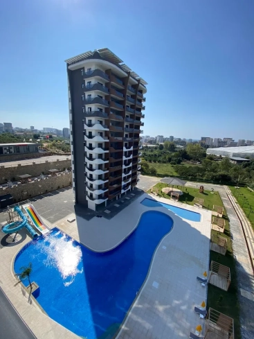 1+1 Apartment in Mahmutlar — New 2023 Residence, Furnished, Pools and €65,000 Price