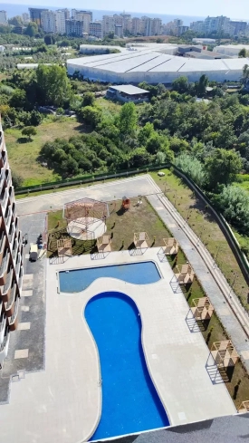 1+1 Apartment in Mahmutlar — New 2023 Residence, Furnished, Pools and €65,000 Price