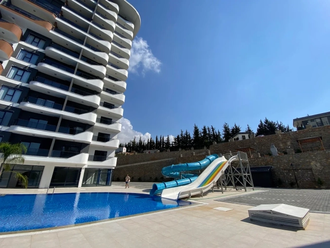 1+1 Apartment in Mahmutlar — New 2023 Residence, Furnished, Pools and €65,000 Price