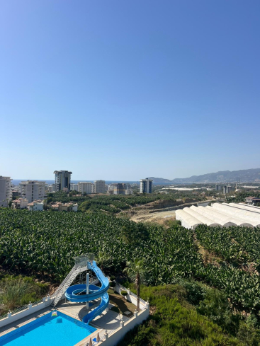 Buy a 1+1 Apartment in Mahmutlar, Alanya — Furnished Apartment with Open Mountain Views for €66,000