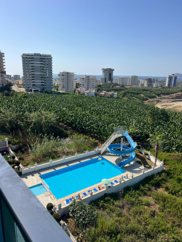 Buy a 1+1 Apartment in Mahmutlar, Alanya — Furnished Apartment with Open Mountain Views for €66,000