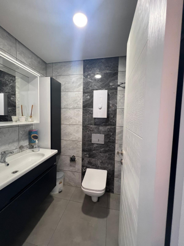 Buy a 1+1 Apartment in Mahmutlar, Alanya — Furnished Apartment with Open Mountain Views for €66,000