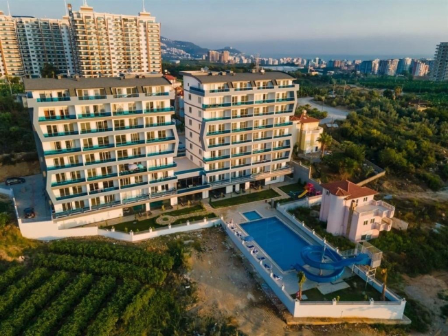 Buy a 1+1 Apartment in Mahmutlar, Alanya — Furnished Apartment with Open Mountain Views for €66,000