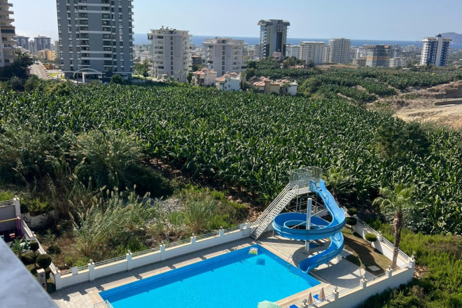 Buy a 1+1 Apartment in Mahmutlar, Alanya — Furnished Apartment with Open Mountain Views for €66,000