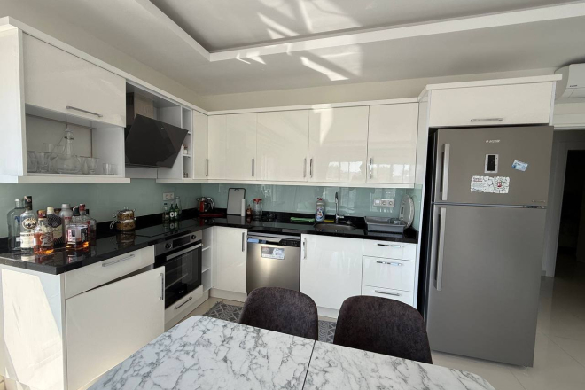 Buy a 2+1 Apartment in Mahmutlar, Alanya — Furnished 120 m² Apartment with City and Mountain Views for €160,000