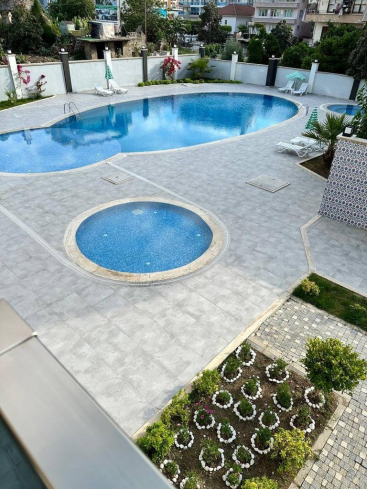Buy a 1+1 Apartment in Mahmutlar, Alanya — Furnished 50 m² Apartment in Family Garden for €82,000