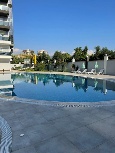 Buy a 1+1 Apartment in Mahmutlar, Alanya — Furnished 50 m² Apartment in Family Garden for €82,000