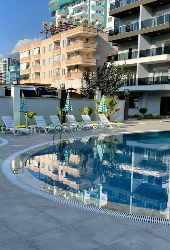 Buy a 1+1 Apartment in Mahmutlar, Alanya — Furnished 50 m² Apartment in Family Garden for €82,000
