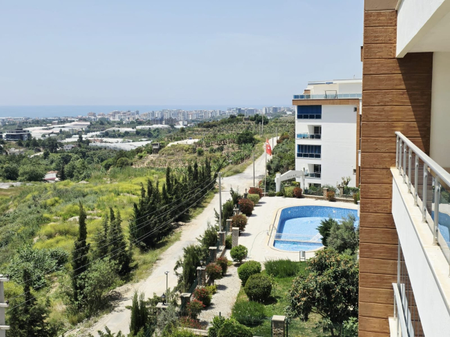 Buy a 2+1 Apartment in Kargicak, Alanya — Furnished 100 m² Apartment with Sea View, Pools and Beach Shuttle for €127,000