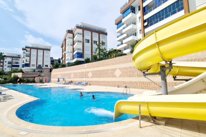 Buy a 2+1 Apartment in Kargicak, Alanya — Furnished 100 m² Apartment with Sea View, Pools and Beach Shuttle for €127,000