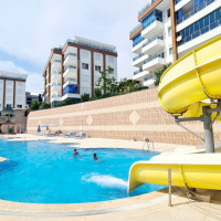 Buy a 2+1 Apartment in Kargicak, Alanya — Furnished 100 m² Apartment with Sea View, Pools and Beach Shuttle for €127,000