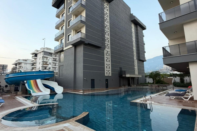 Buy a furnished 1+1 sea-view apartment in Kargicak — 55 m², 300 m from the beach
