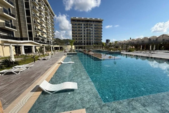 Sea-View 1-Bedroom Apartment in Demirtas with Pools and Spa — €62,000